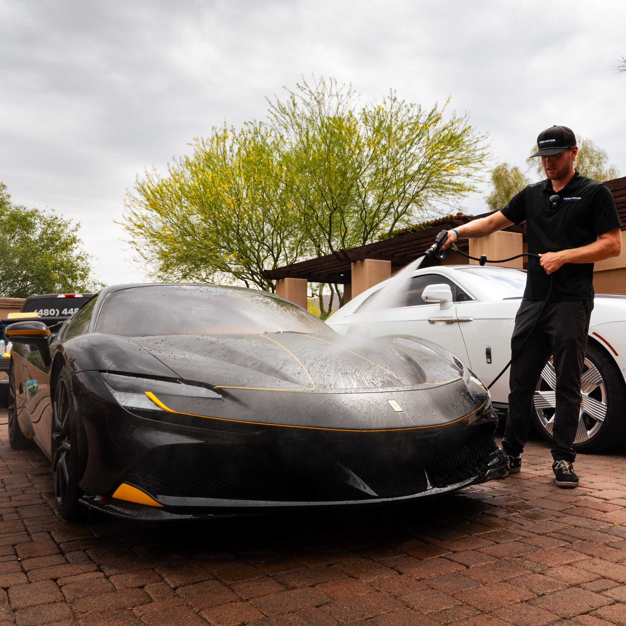 Pure Power Detailer washing luxury Ferrari during premium detailing service